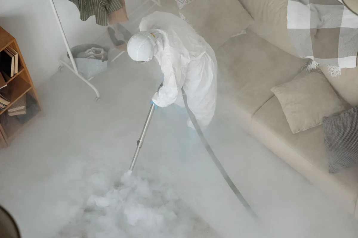 Biohazard cleanup technician in protective equipment, Bound Brook, NJ